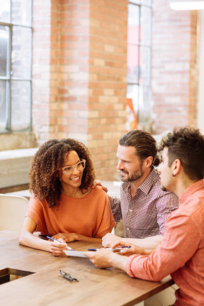 couple talking with real estate agent